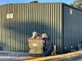 Industrial scene landscape overflowing industrial dumpster