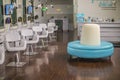 Primp and blow beauty salon Aqua blue and white round sofa Royalty Free Stock Photo