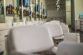 Primp blow beauty salon interior row of white seats Royalty Free Stock Photo