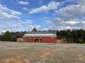 A red vintage retro old abandoned building on a vacant lot