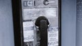 Vintage Blue outdoors public payphone booth receiver on hook