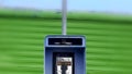 Vintage Blue outdoors public payphone booth top and pole