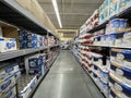 Walmart grocery store interior looking down paper goods aisle