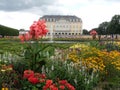 Augustusburg Castle in Bruehl NRW Germany . German pleasure palace with a colorful flower bed and a fountain in front of it.