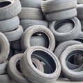 AULLA, MASSA CARRARA, ITALY - AUGUST 28, 2019: Old car and vehicle tyres, tires wait to be disposed of. Closeup detail.