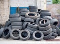 AULLA, MASSA CARRARA, ITALY - AUGUST 28, 2019: Old car and vehicle tyres, tires wait to be disposed of.
