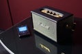 Marshall Kilburn bluetooth speaker and phone with Spotify music app open on table