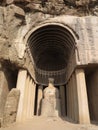 Aurangabad Cave 4 features a square chaitya prayer hall. The pillars and stupa have been partially reconstructed.