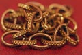 Aureate chain close-up on a red background Royalty Free Stock Photo