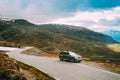 Aurlandsfjellet, Norway. Car SUV Parked Near Aurlandsfjellet Scenic Route Road In Summer Norwegian Landscape. Natural Royalty Free Stock Photo