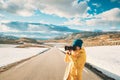 Aurlandsfjellet, Norway. Young Happy Woman Tourist Traveler Photographer Taking Pictures Photos Of Aurlandsfjellet Royalty Free Stock Photo