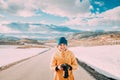 Aurlandsfjellet, Norway. Young Happy Woman Tourist Traveler Photographer Taking Pictures Photos Of Aurlandsfjellet Royalty Free Stock Photo