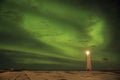 Aurora above the lighthouse on Gardskagi, Keflavik, Iceland