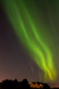 Aurora borealis above houses of old ReykjavÃÂ­k Royalty Free Stock Photo