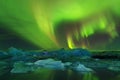 Aurora borealis above the sea. Jokulsarlon glacier lagoon, Iceland. Green northern lights. Starry sky with polar lights. Night Royalty Free Stock Photo