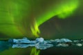 Aurora borealis above the sea. Jokulsarlon glacier lagoon, Iceland. Green northern lights. Starry sky with polar lights. Royalty Free Stock Photo