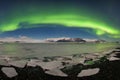 Aurora borealis above the sea. Jokulsarlon glacier lagoon, Iceland. Green northern lights. Starry sky with polar lights. Royalty Free Stock Photo