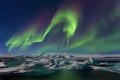 Aurora borealis above the sea. Jokulsarlon glacier lagoon, Iceland. Green northern lights. Starry sky with polar lights. Night Royalty Free Stock Photo