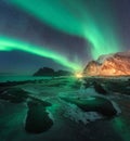 Aurora borealis above Uttakleiv beach in Lofoten islands, Norway Royalty Free Stock Photo