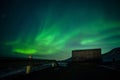 Aurora borealis above the watertank in Longyearbyen Royalty Free Stock Photo