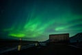 Aurora borealis above the watertank in Longyearbyen Royalty Free Stock Photo