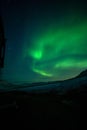 Aurora borealis above the watertank in Longyearbyen Royalty Free Stock Photo