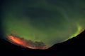 Aurora Borealis against the sunset sky in Iceland