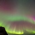 689 Aurora Borealis: A breathtaking and celestial background featuring the aurora borealis in mesmerizing and deep colors that c Royalty Free Stock Photo