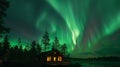 Aurora borealis flying over the chalet in North Sweden