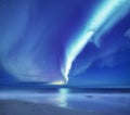 Aurora borealis on the Lofoten islands, Norway. Green northern lights above ocean. Night sky with polar lights. Night winter lands Royalty Free Stock Photo