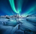 Aurora Borealis, Lofoten islands, Norway. Nothen light, mountains and ocean. Winter landscape at the night time. Royalty Free Stock Photo