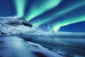 Aurora Borealis, Lofoten islands, Norway. Winter landscape in the night time during polar lights. Nothen light, mountain and froze Royalty Free Stock Photo