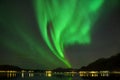 Aurora Borealis on the Lofoten Islands, Reine Norway. Green northern lights above mountains. Night sky with polar sky Royalty Free Stock Photo
