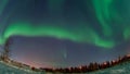 Aurora borealis in night northern sky. Ionisation of air particles in the upper atmosphere.
