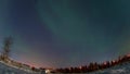 Aurora borealis in night northern sky. Ionization of air particles in the upper atmosphere.