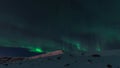 Aurora borealis in night northern sky. Ionization of air particles in the upper atmosphere.