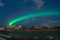 Aurora Borealis on night starry sky. Multi-coloured northern lights over Icelandic landscape. Arctic area