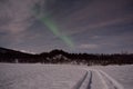 Aurora borealis, northern light over winter river landscape at night Royalty Free Stock Photo