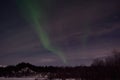 Aurora borealis, northern light over winter river landscape at night Royalty Free Stock Photo