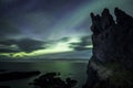 Aurora Borealis (Northern Lights) above Icelandic rock formation