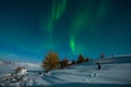 Aurora Borealis or Northern lights the amazing wonder of nature in the dramatic skies of Iceland. Night landscape with the green l Royalty Free Stock Photo