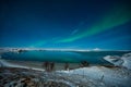 Aurora Borealis or Northern lights the amazing wonder of nature in the dramatic skies of Iceland. Night landscape with the green l Royalty Free Stock Photo