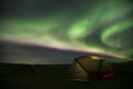 Aurora Borealis Northern Lights Iceland and illuminated tent