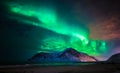 Aurora borealis over Skagsanden beach. Lofoten Islands, Norway