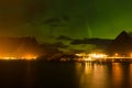 Aurora borealis, dramatic polar lights over the mountains in the North of Europe - Lofoten islands, Norway Royalty Free Stock Photo