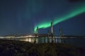 Aurora Borealis over city lights