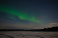 Aurora Borealis over the frozen Imandra Lake. Khibiny, Kola Peninsula. Russia