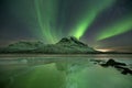 Aurora borealis over a frozen lake in northern Norway