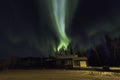 Aurora Borealis Over a House