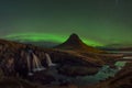 Aurora Borealis over Kirkjufellsfoss and Kirkjufell mountain